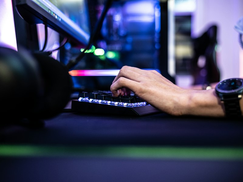 Neon-lit gaming setup at night